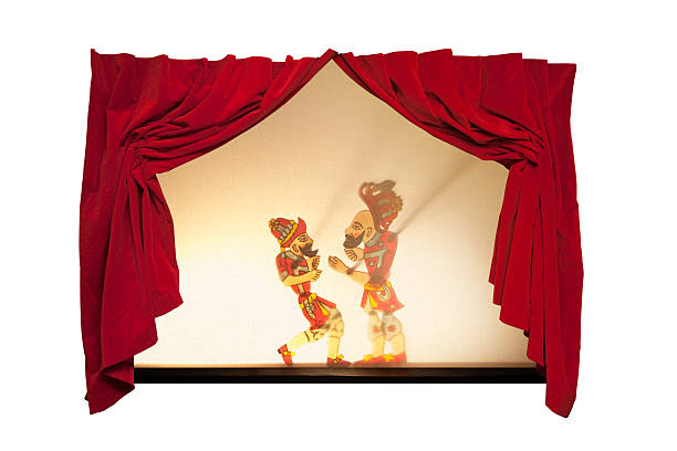 Karagoz and Hacivat on curtain-drawn stage The Main Characters of Turkish Shadow Puppet Tradition: Karagoz and Hacivat. hacivat karagoz stock pictures, royalty-free photos & images