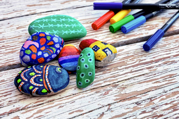 istock Hand-painted colorful stones and pens 1055477172
