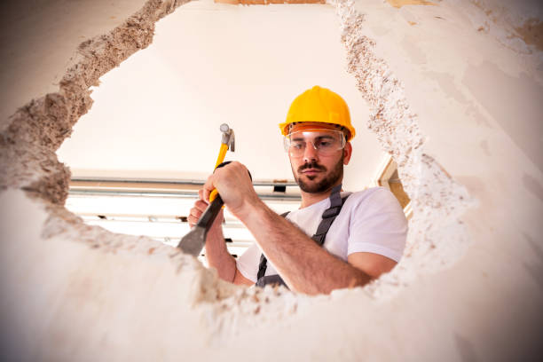 istock Handyman in yellow protective helmet 1055477500