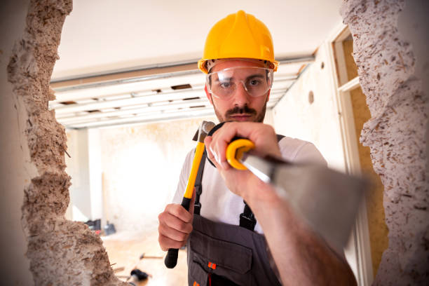 istock Crafty handyman wearing yellow helmet 1055478982