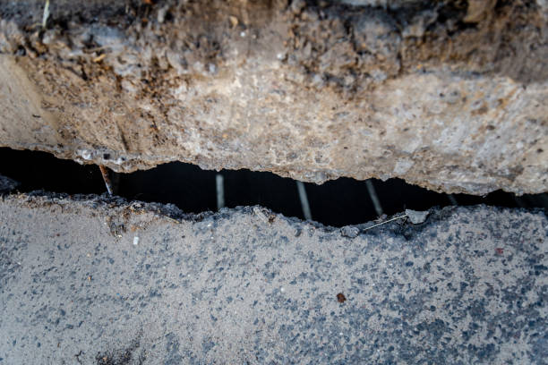 istock damaged asphalt at the broken bridge 1055479284