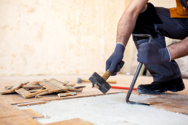 istock Crafty handyman removing old parquet 1055484278