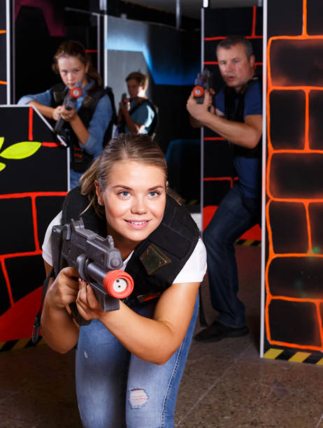 istock Woman playing lasertag with family 1055486822