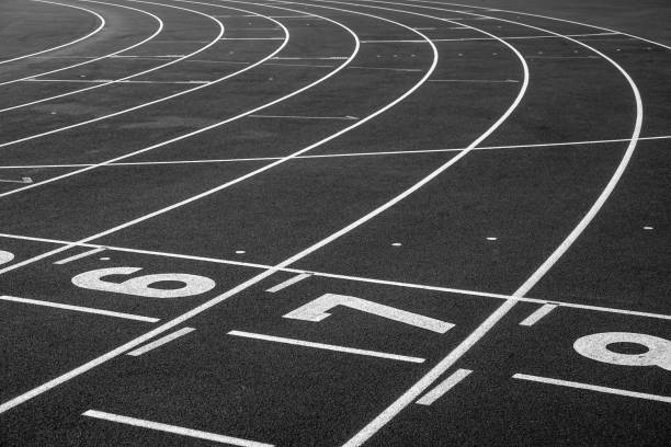 Numbers on a running track. Empty sports arena.