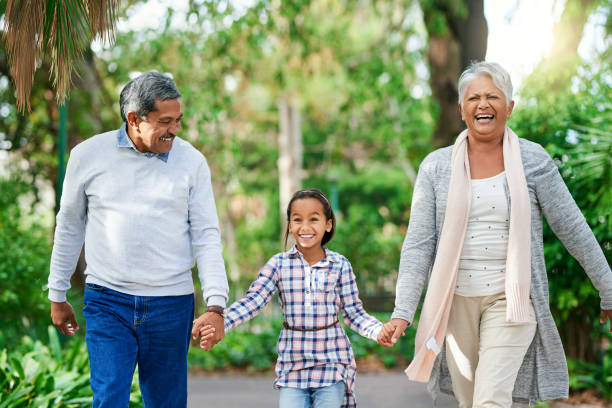 istock Hand in hand with granny and grandpa 1055498802