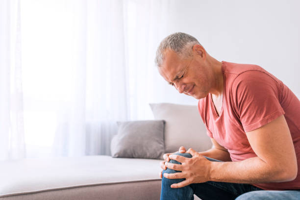 istock Feeling the pain in his knee 1055501270