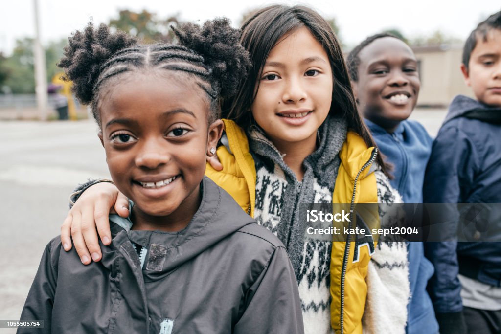 children are ready for field trip Group of kids standing in a row Child Stock Photo