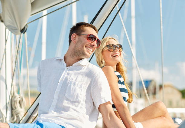 istock smiling couple sitting on yacht deck 1055513032