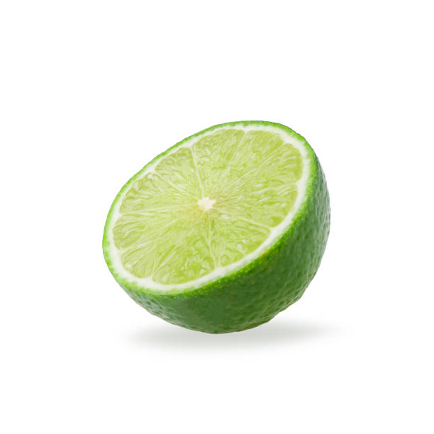 istock Half with slice of fresh green lime isolated on white background 1055513200