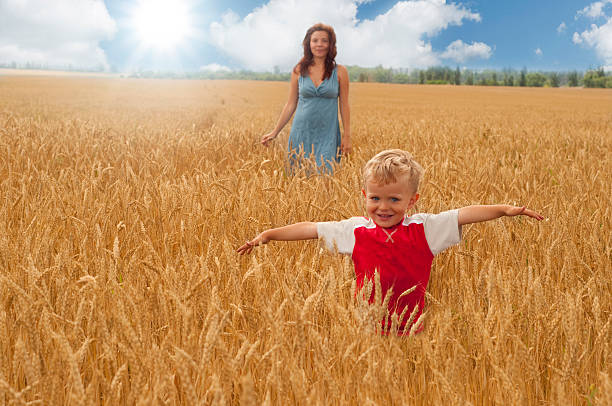 istock Mom and young son on a wheat field 105551321