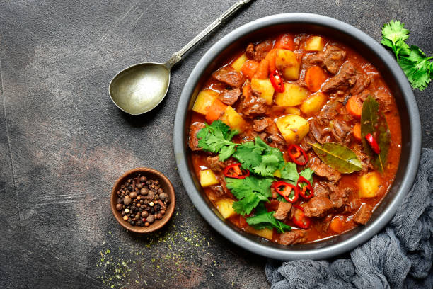 istock Meat stewed with vegetables in tomato sauce (hungarian goulash) 1055520032