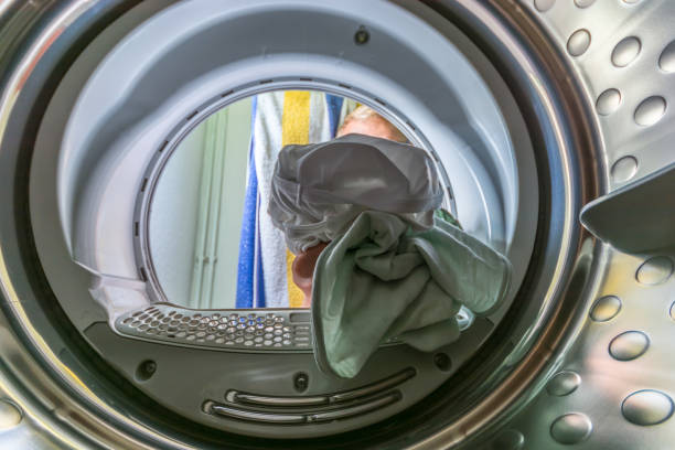 istock View from a washing drum which is loaded with dirty laundry 1055520868