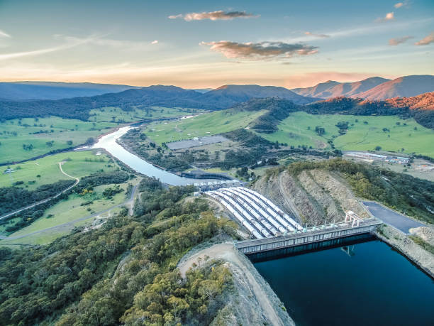 Huge pipes of Tumut hydroelectric power station at sunset stock photo