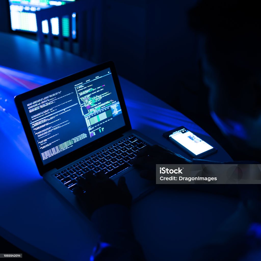 Hacker Using Anonymous Hacker Using Laptop In Darkness Stock Photo - Download Image ...