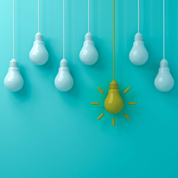 istock Think different concept One hanging  yellow idea light bulb standing out from white unlit bulbs on blue green pastel color background leadership and individuality creative idea concepts 3D rendering 1055547220