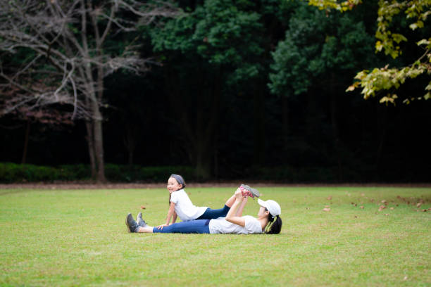 istock Mother and daughter stretching 1055547544