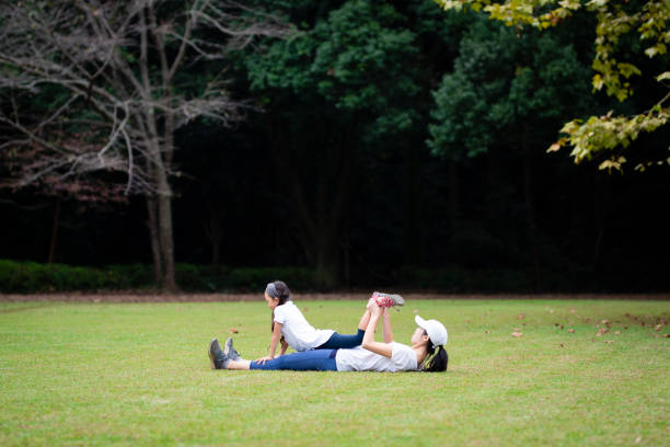 istock Mother and daughter stretching 1055547568