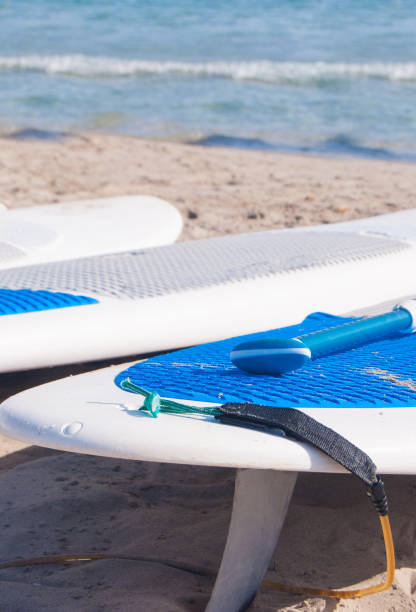 istock Surfboards on shoreline of sand 1055547760