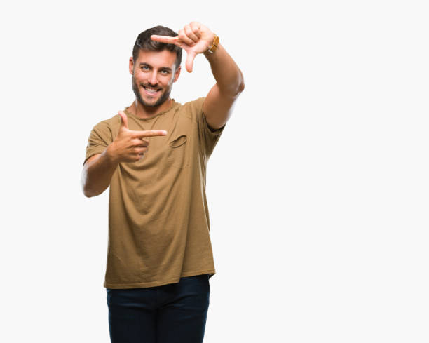 istock Young handsome man over isolated background smiling making frame with hands and fingers with happy face. Creativity and photography concept. 1055547866