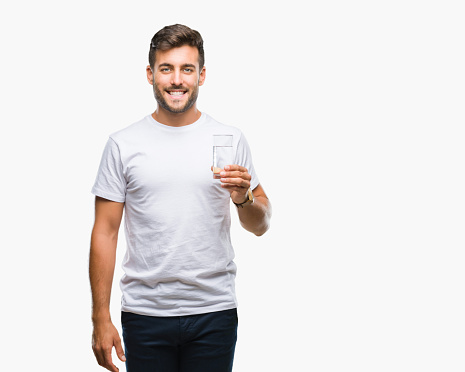 Human hand raised and holding up iced drink to the sky on the park