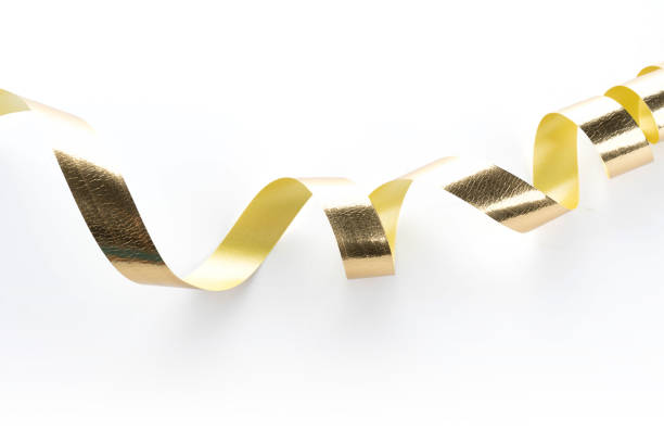 istock Golden ribbon roll isolated on white background 1055556004