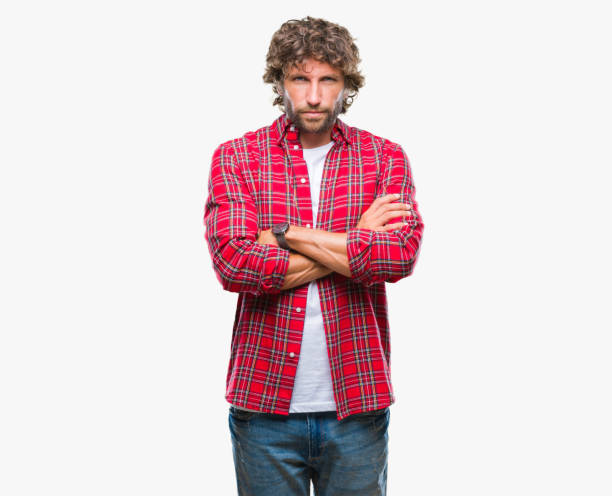 istock Handsome hispanic model man over isolated background skeptic and nervous, disapproving expression on face with crossed arms. Negative person. 1055560400