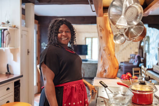 istock African-American preparing thanksgiving dinner 1055560622
