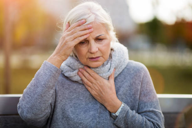 istock Senior woman suffering from a headache 1055560888