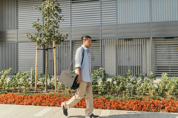 istock Mid adult Japanese walking to work 1055561222