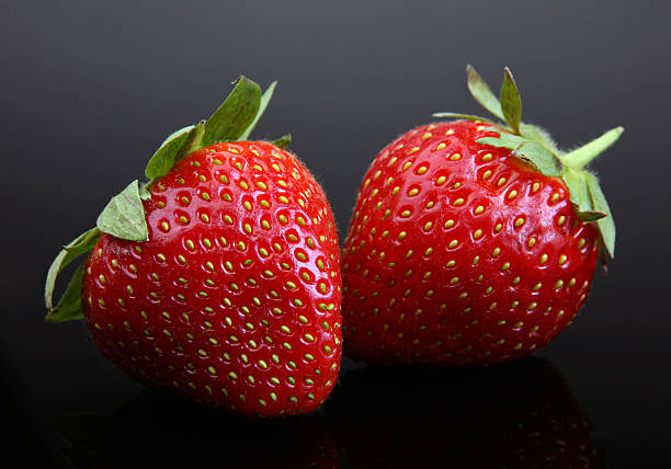 istock Strawberry berry on black 105556647