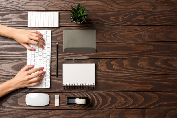 istock Overhead shot of office desktop 1055570932