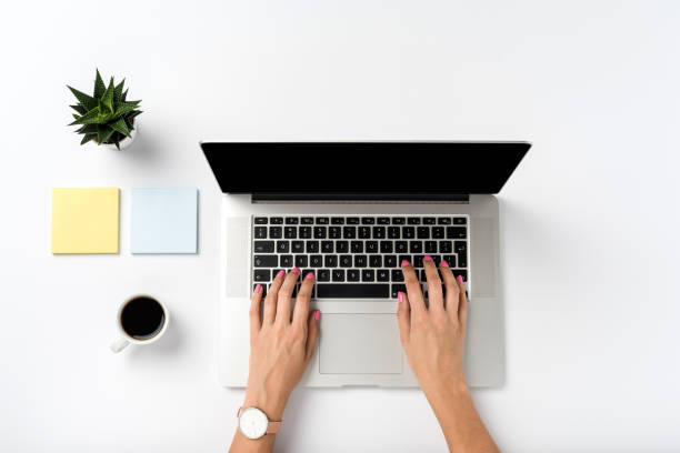 istock Woman working on laptop. Close up 1055571024