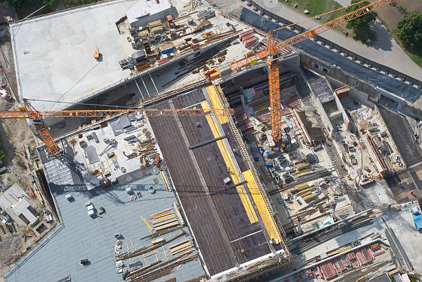 istock Aerial view of construction site and large crane 105557393
