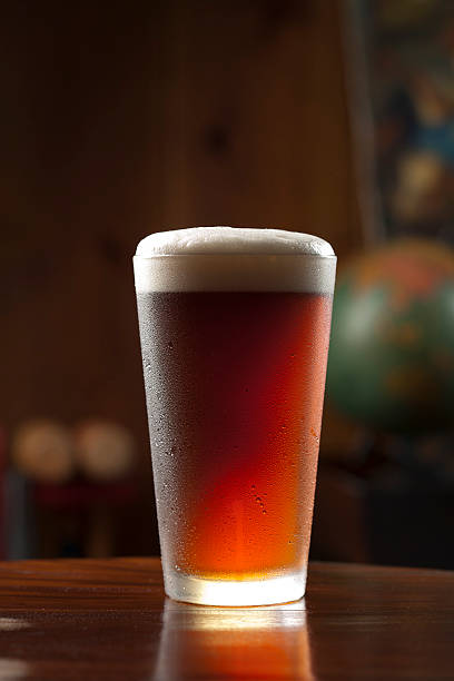 istock Glass of cold foamy beer on a bar 105557584