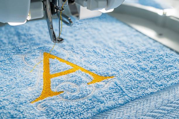 istock Embroidery machine and alphabet design on towel 1055582868