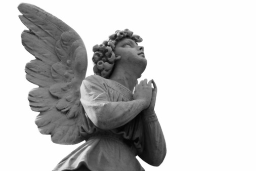 Beautiful one-armed angel in meditation or repose in Columbus(Colon) Cemetery, Havana.