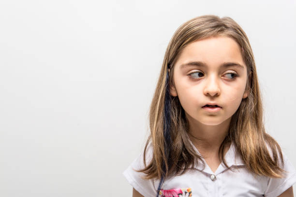 istock Little girl looking sideways 1055584238