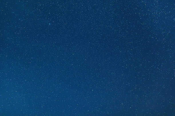 istock Night sky backgrounds with stars and clouds 1055587344