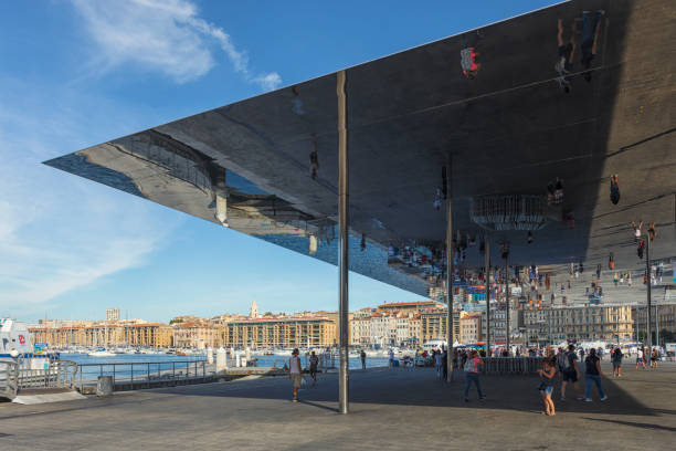 Old Port, Marseille L'Ombrière de Norman Foster, a covering structure clad in mirrors next to the Vieux port subway station by the old harbor in Marseille. marseille station stock pictures, royalty-free photos & images