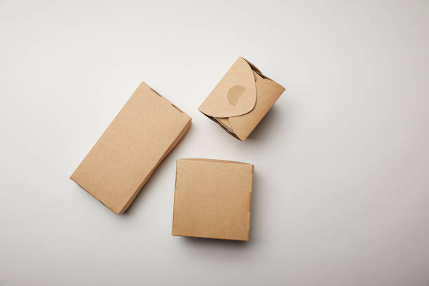 istock top view of noodle box and cardboard boxes on white surface 1055587624