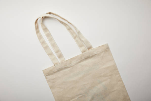 istock elevated view of cotton bag on white surface, minimalistic concept 1055587940