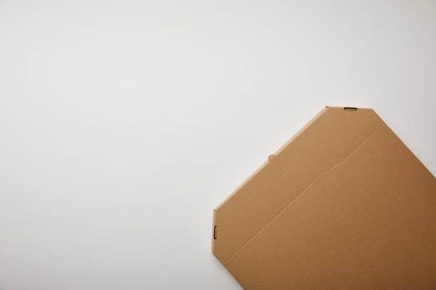 istock top view of cardboard pizza box on white surface, minimalistic concept 1055587968