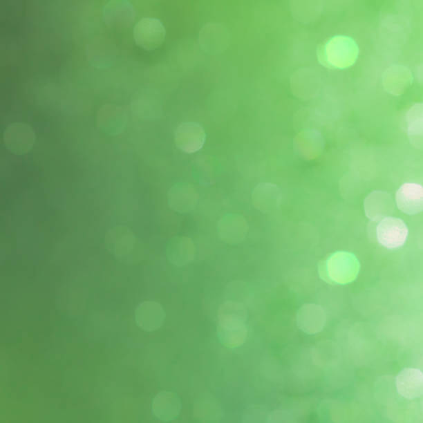 istock Bokeh abstract texture. Beautiful christmas background in green colors. Defocused 1055591330