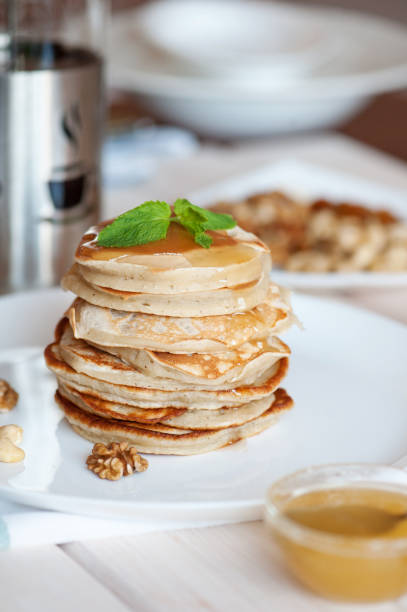 istock Pancake with honey or maple syrup 1055592760