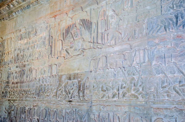 The wall of one of the galleries of Angkor Wat showing episodes from the Hindu epics The wall of one of the galleries of Angkor Wat with its linear arrangement of stone carving, adorned with bas-reliefs showing large-scale narrative scenes mainly depicting episodes from the Hindu epics the Ramayana and the Mahabharata hystoric stock pictures, royalty-free photos & images