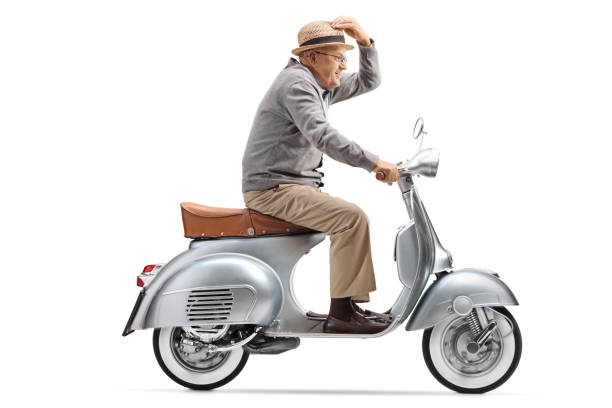 istock Gentleman riding a vintage motorbike 1055593892