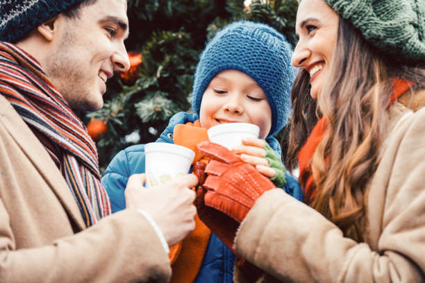 istock Family visiting Christmas Market 1055593910