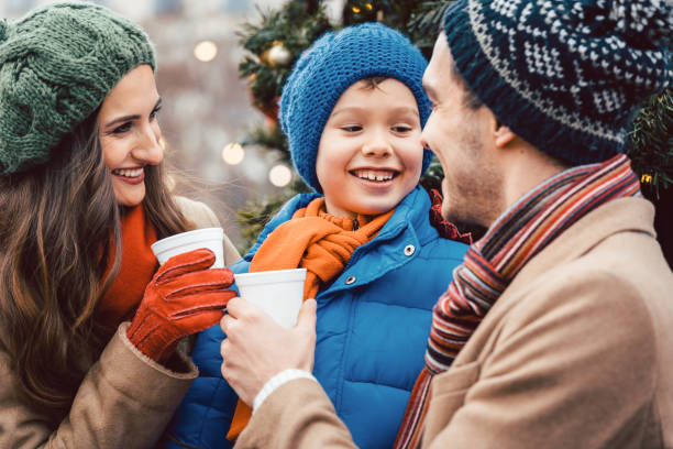 istock Family visiting Christmas Market 1055593966