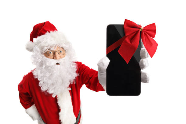 istock Santa Claus holding a phone with a red ribbon 1055594926