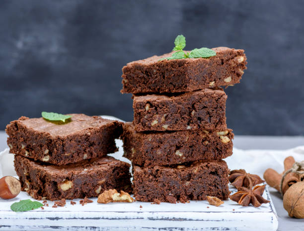 istock stack of baked square pieces of brownie pie 1055596980